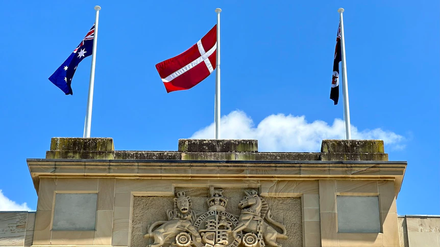 Tasmanian parliament takes down Aboriginal flag for Danish to celebrate Queen Mary, drawing criticism from Aboriginal community